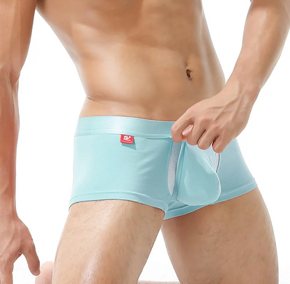 Light blue boxer briefs worn by a person on a white background